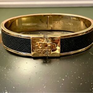 Tory Burch- 1”Black Leather Inlay Hinged Gold Bracelet. Shows some minimal wear.